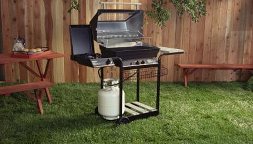 Photo Credit: Jupiterimages/Comstock/Getty Images Grill in backyard