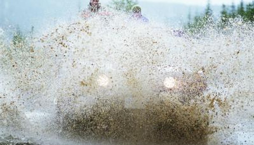 Photo Credit: Mike Powell/Lifesize/Getty Images ATV driving through mud