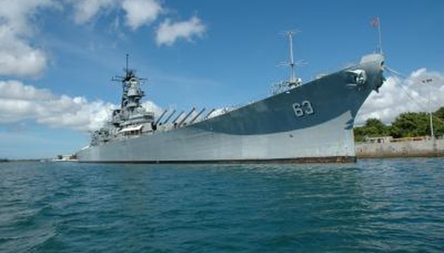 Battleships, such as the USS Missouri, carried heavy guns to attack enemy warships.