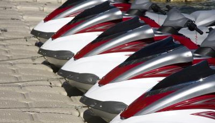 Photo Credit: Jimmy Lopes/Hemera/Getty Images Group of jet ski's at dock