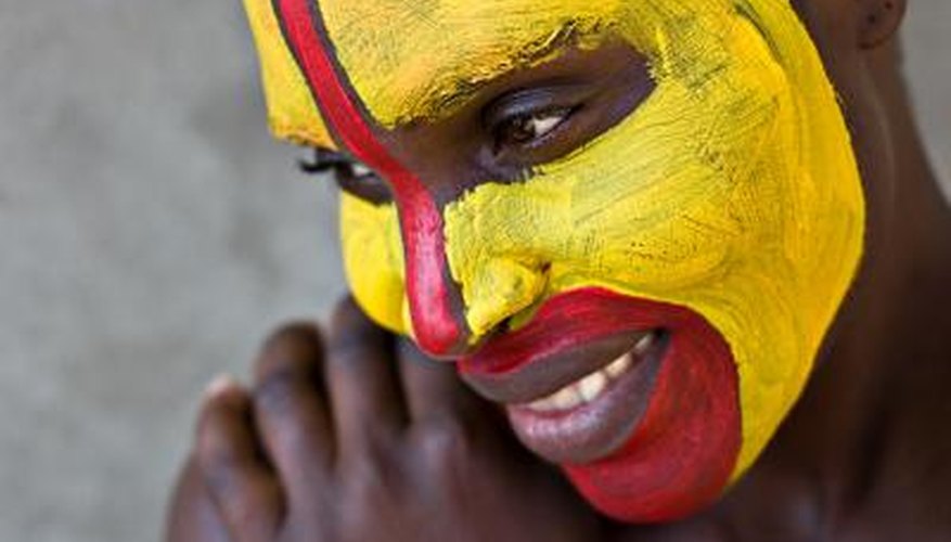 Young Zulu female with painted face.
