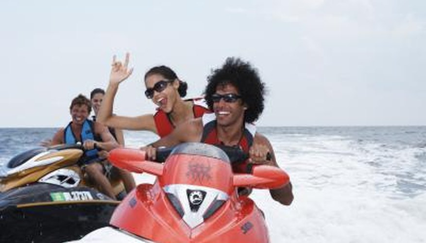 Photo Credit: Jim Arbogast/Digital Vision/Getty Images friends jet skiing on Lake Tarpon