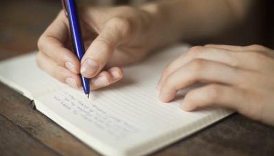 Person writing a letter.