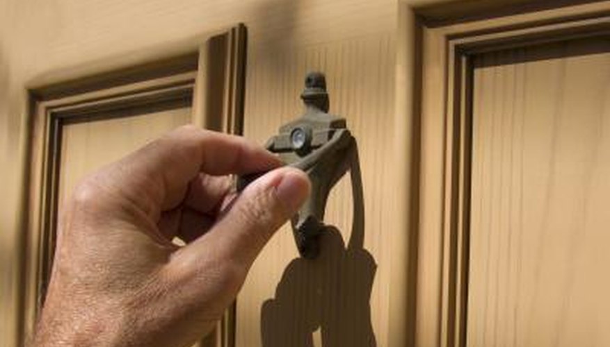 Hand on door knocker.