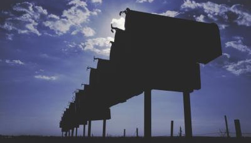 Silhouettes of mailboxes in a row.