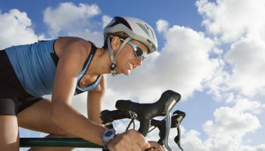 Photo Credit: Polka Dot Images/Polka Dot/Getty Images Woman cycling