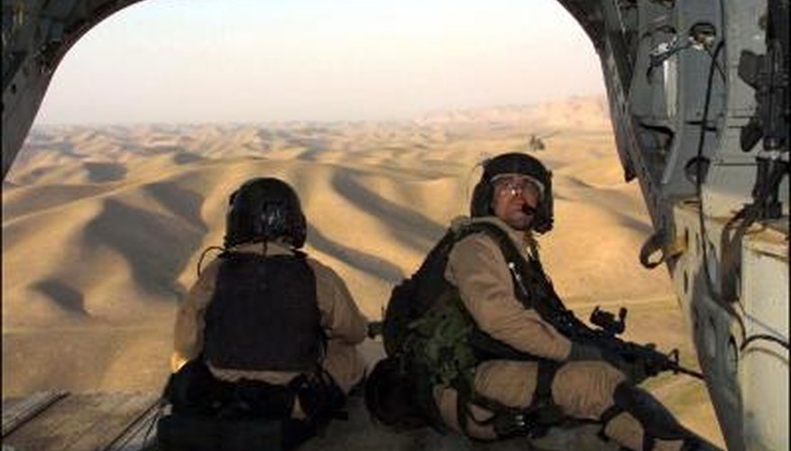US Army Special Forces troops aboard chinook helicopter over Afghanistan