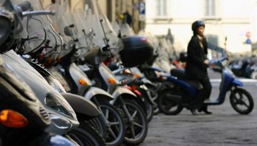 Photo Credit: Marc C. Johnson/iStock/Getty Images Woman parking her scooter in Florence, Italy