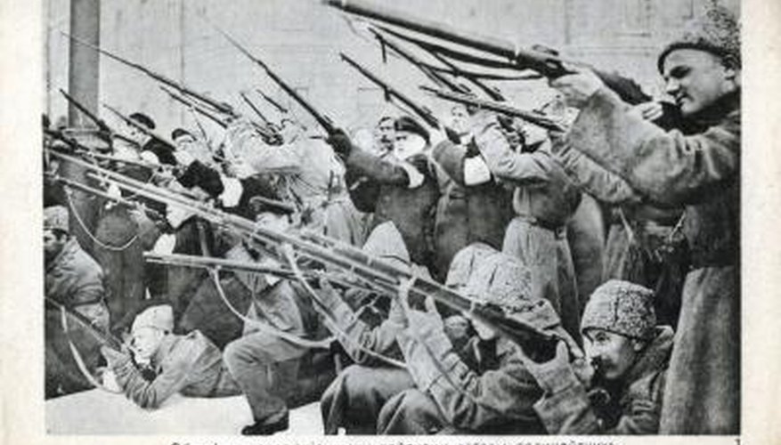 Photo Credit: Photos.com/Photos.com/Getty Images The men in this image hold Mosin-Nagant rifles, which fire 7.62x54mm ammunition.