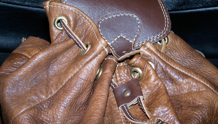 A cable lock discretely secures a drawstring bag.