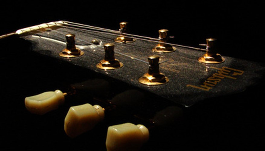 The truss rod cover on a ES-335 Dot guitar is the bell-shaped plate on the head stock.