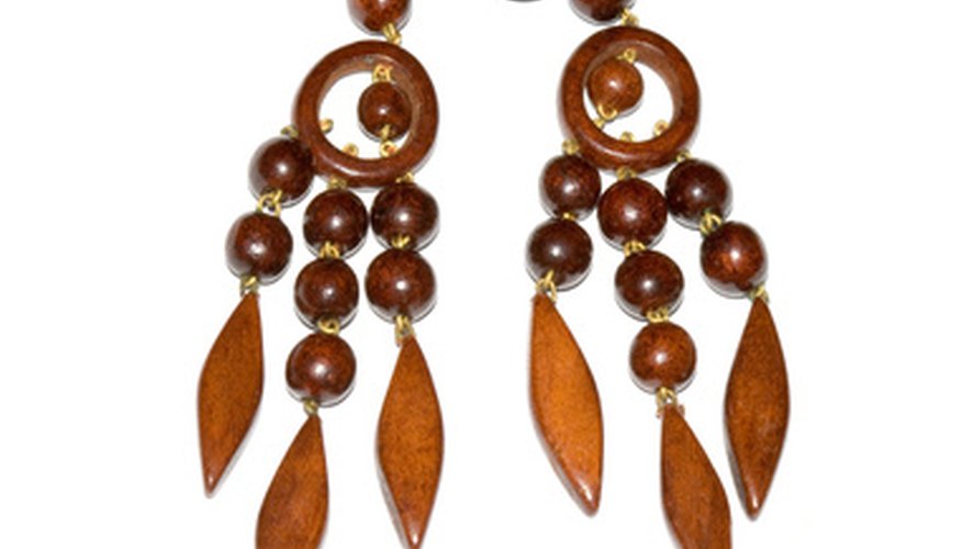 Dangling earrings can give a glamorous look, but people with freshly pierced ears should wait before wearing them.