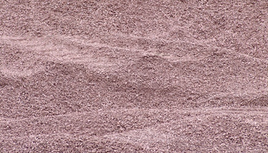 Abrasive blasting may involve the use of sand.