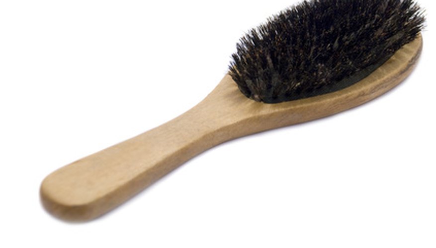 Softening hardened bristles may prevent you having to buy a new hairbrush.