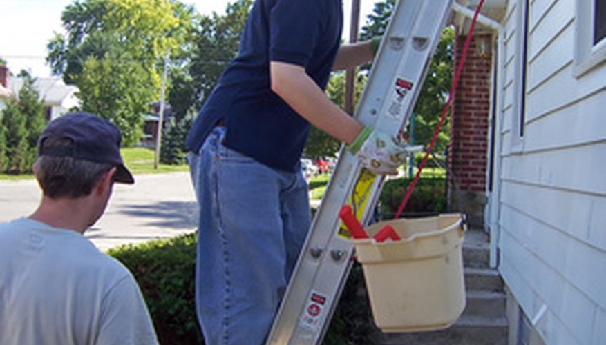Make repairs to a gutter by climbing up a ladder.