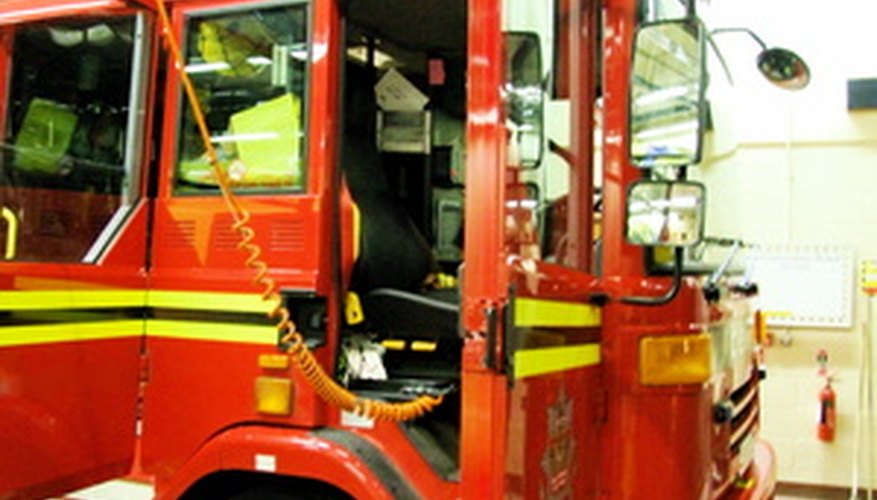 Big red firetrucks are magnets for small boys.