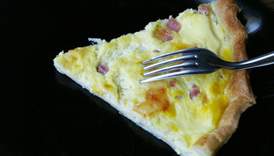 Warm a quiche in the microwave or oven properly to enjoy the egg dish.