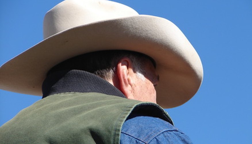 A hat makes it easy to identify a cowboy.