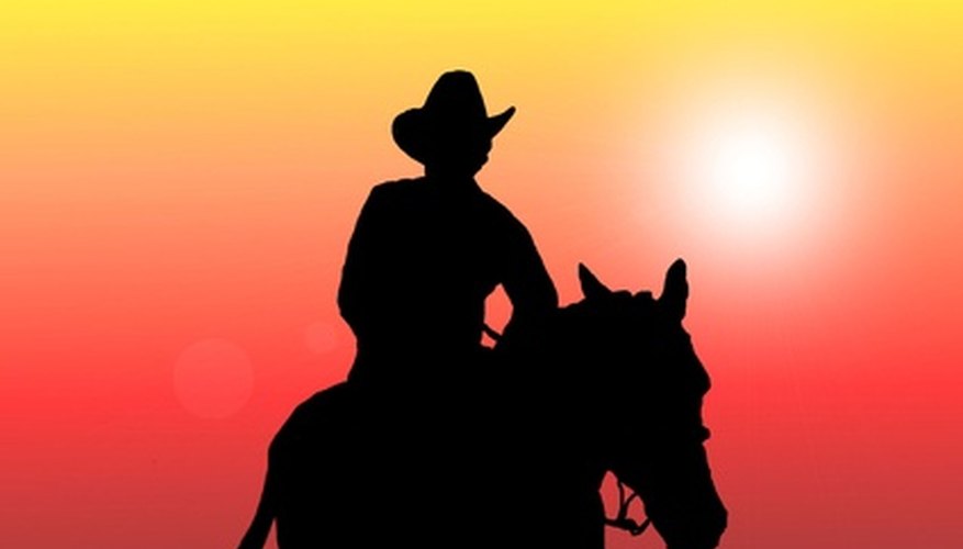 Back lighting techniques were used to portray the cowboy and horse in silhouette.