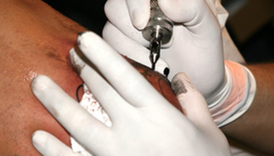 Prevent infection by wiping tattoos with rubbing alcohol before fixing them.