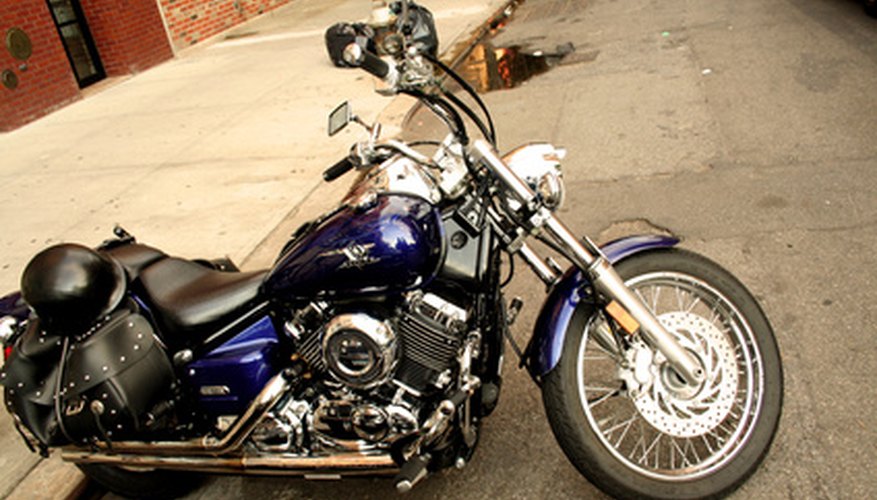 Restore motorcycle engine black and components that have faded or dulled with the help of an engine brightener.