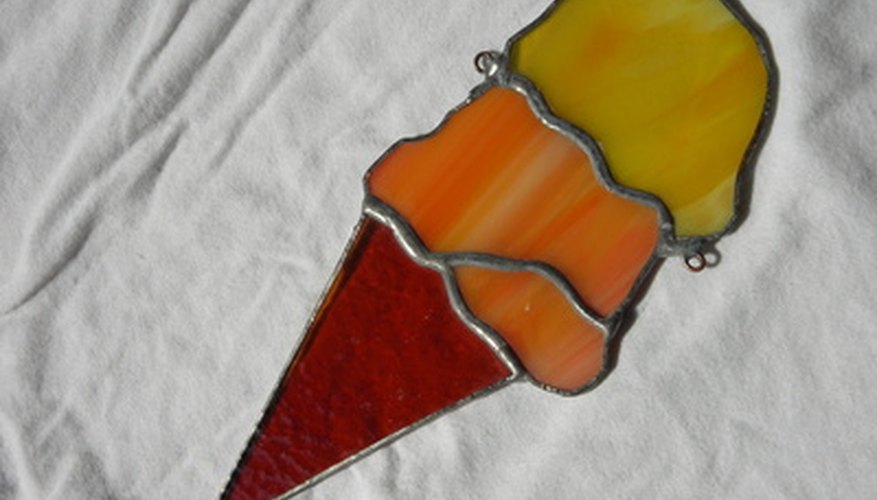 Painting on a transparency will mimic stained glass.