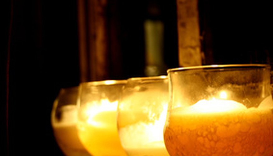 Candles light up the night on a patio.