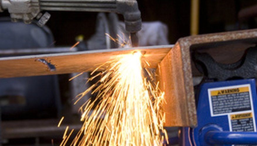 Torch heat eases the process of straightening bent metal rods.