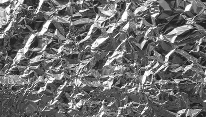 The wrinkled, shiny surface of foil can make it difficult to glue.