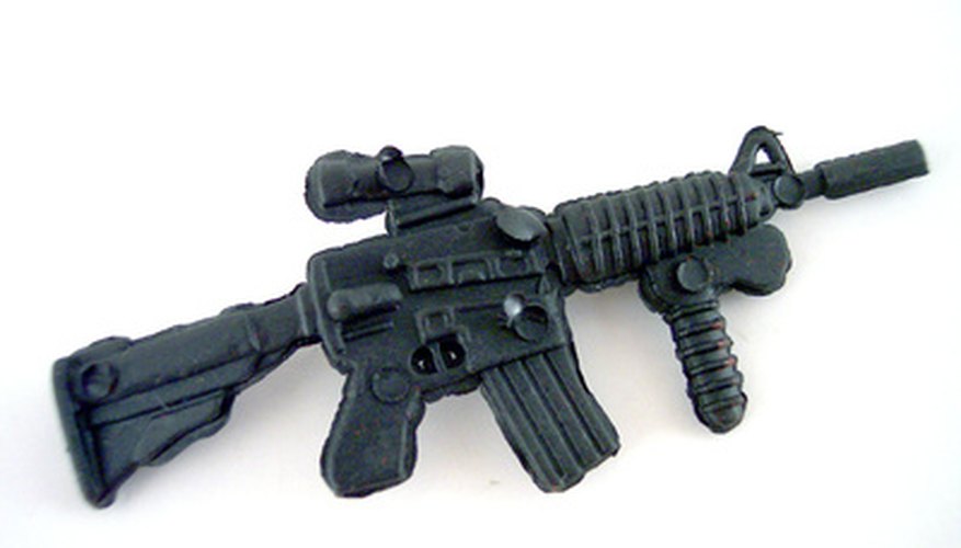 Photo Credit: automatic rifle image by timur1970 from <a href='http://www.fotolia.com'>Fotolia.com</a> Military-style weapons are covered by a Class III license.