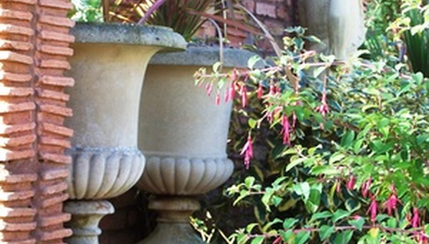 Grecian urns and climbing vines add a Mediterranean touch to your garden.