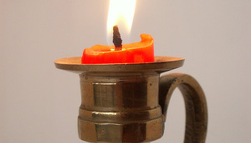 Remove candle wax from brass with care.