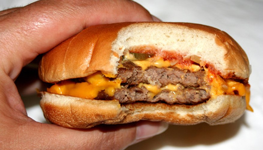 Cheesburgers violate kosher laws by mixing milk and meat.