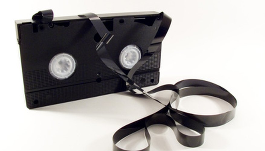 VHS cassette with exposed, snarled videotape.