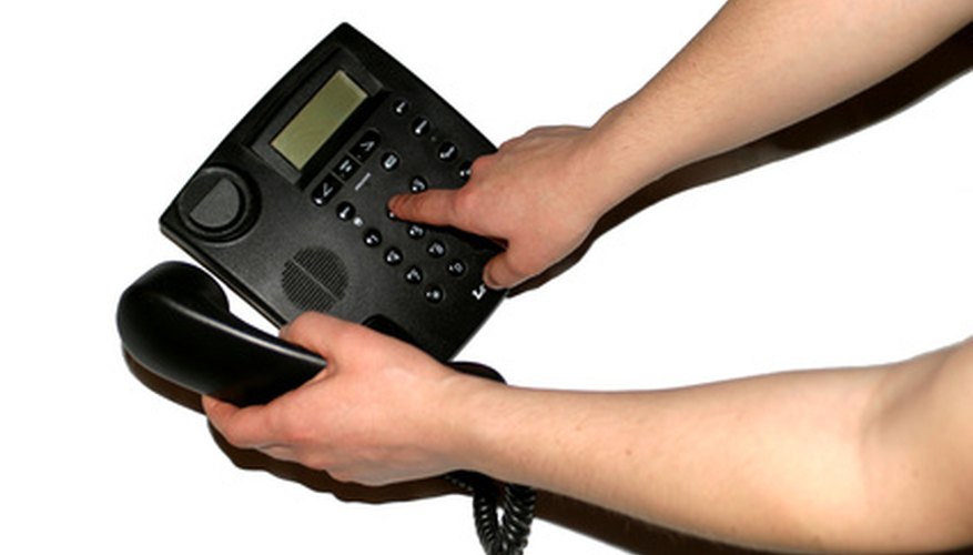 Employee using company phone to page the office.
