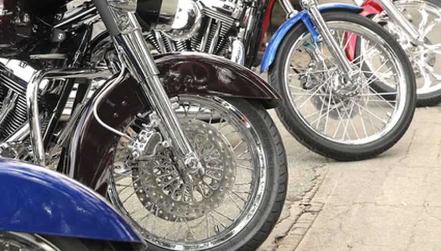 Measuring the rim of a motorcycle.