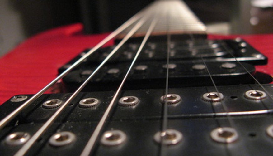 View the guitar from the bridge to inspect the action and neck alignment.