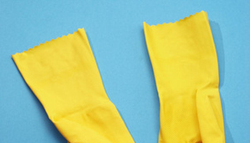 Wearing thick rubber gloves will protect your hands from the hot water.