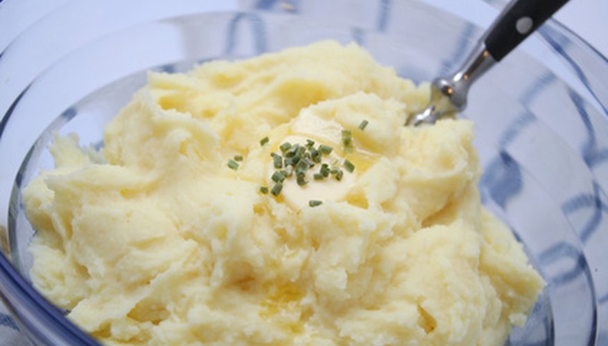 Mash potatoes by hand to avoid the gluey texture that can result from overprocessing.