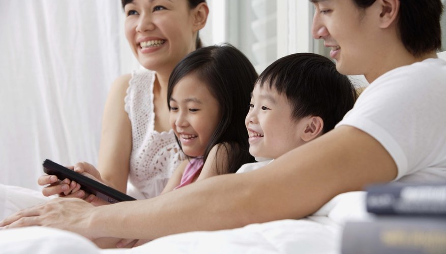 A Chinese family watches a movie on TV