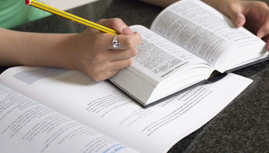 Student researching in a dictionary.