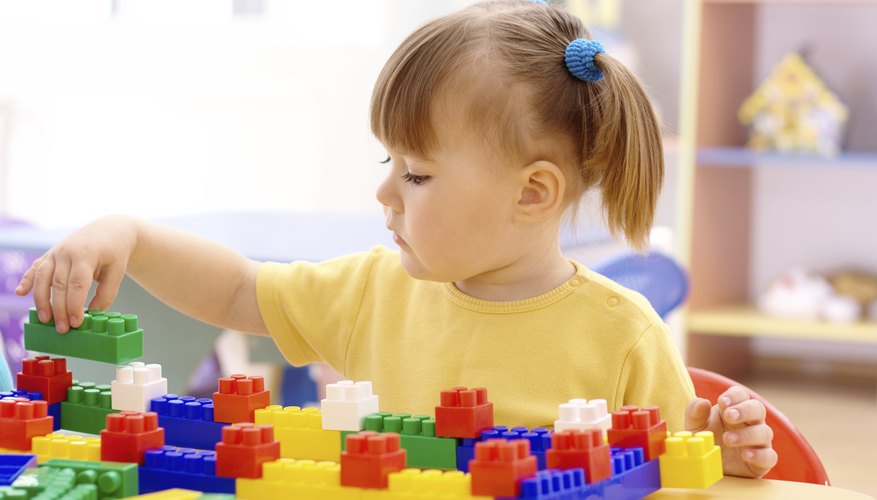 Toys that preschoolers assemble, like Lego blocks, help develop fine motor skills.