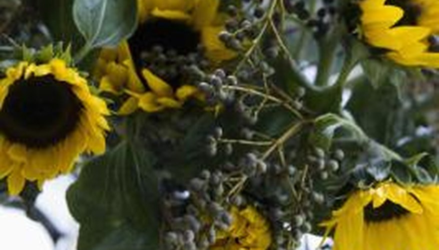Preserve sunflowers in a floral bouquet.