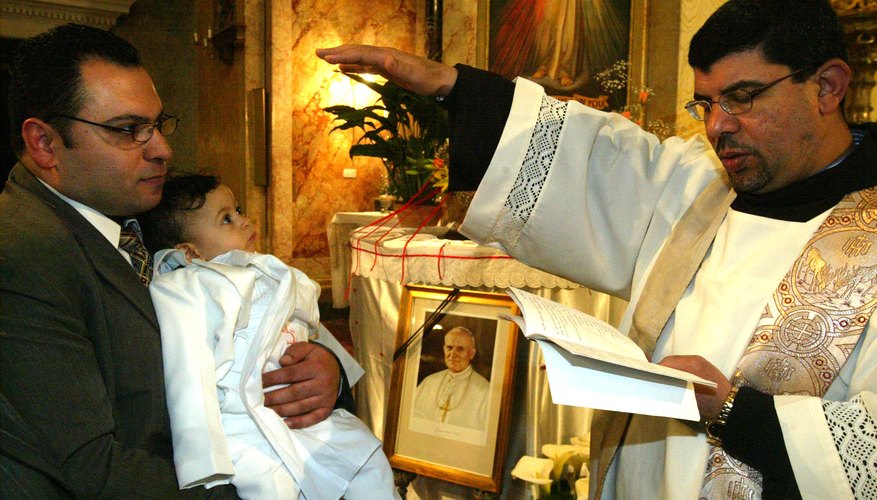 Young child being baptised inside cathedral