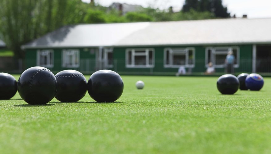 Bowling balls on grass.