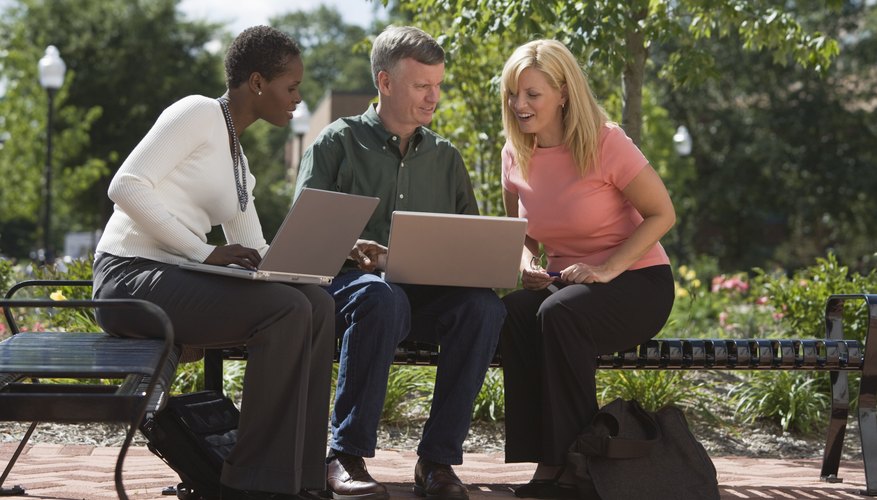 College students are sitting with their professors.
