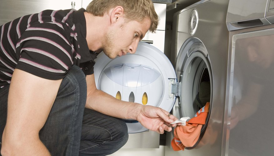 Inspect the garment for residual signs of stains after washing.