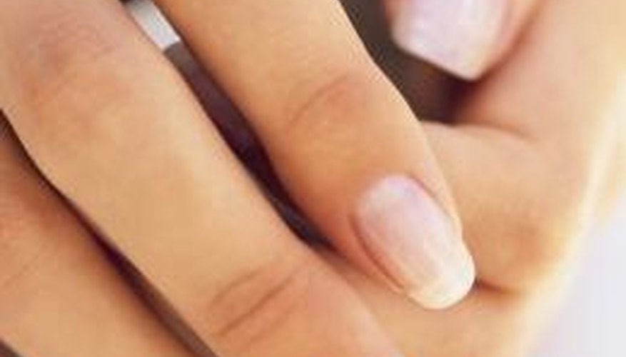 Nail extensions are adhered to the natural nail.