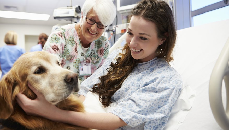 Image of a volunteer visiting a woman in the hospital.