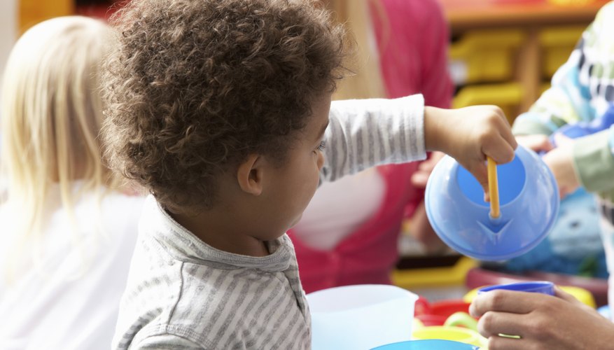 Pre-school boy playing with toys.